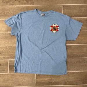 🏝️ Innerlight Surf Shop Florida Lifeguard Logo Tee Delta L Sky Blue